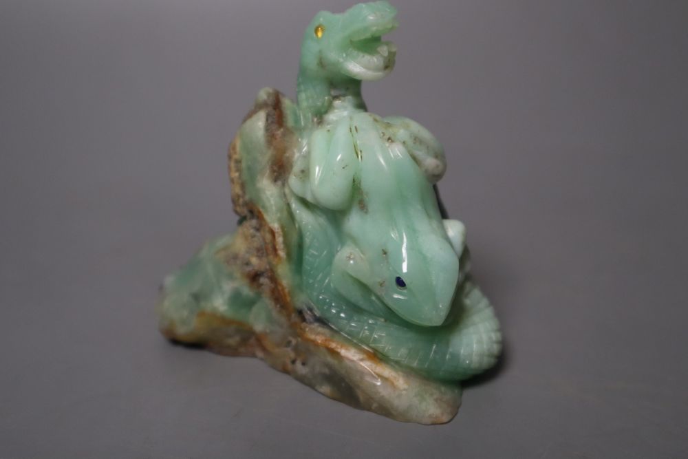 A Chinese jadeite carving of a toad and a serpent, 7.1cm high, with glass and lapis lazuli inset eyes